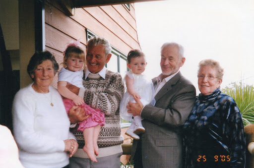 Grandma and grandad holding Kenzie on the right